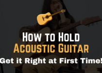 how to hold an acoustic guitar